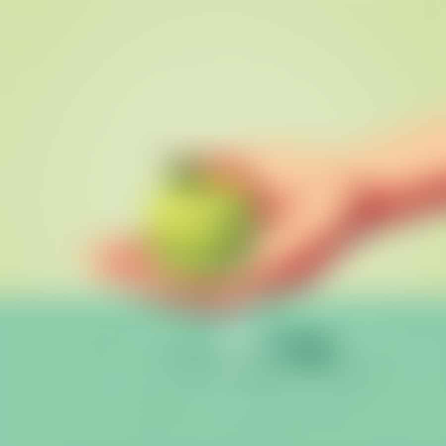 Hands washing an apple under running water